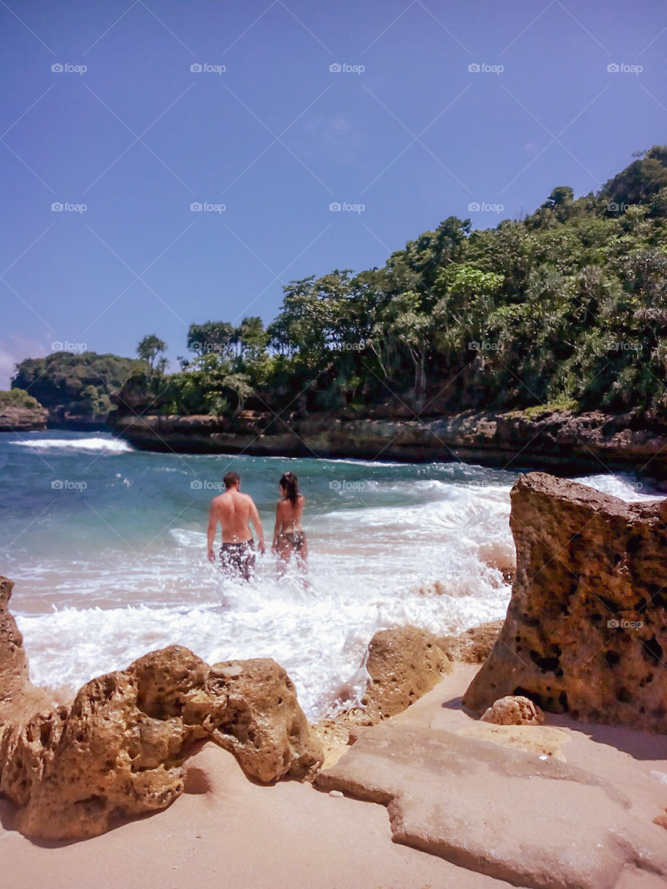 splashing waves on a beach in East Java, Indonesia