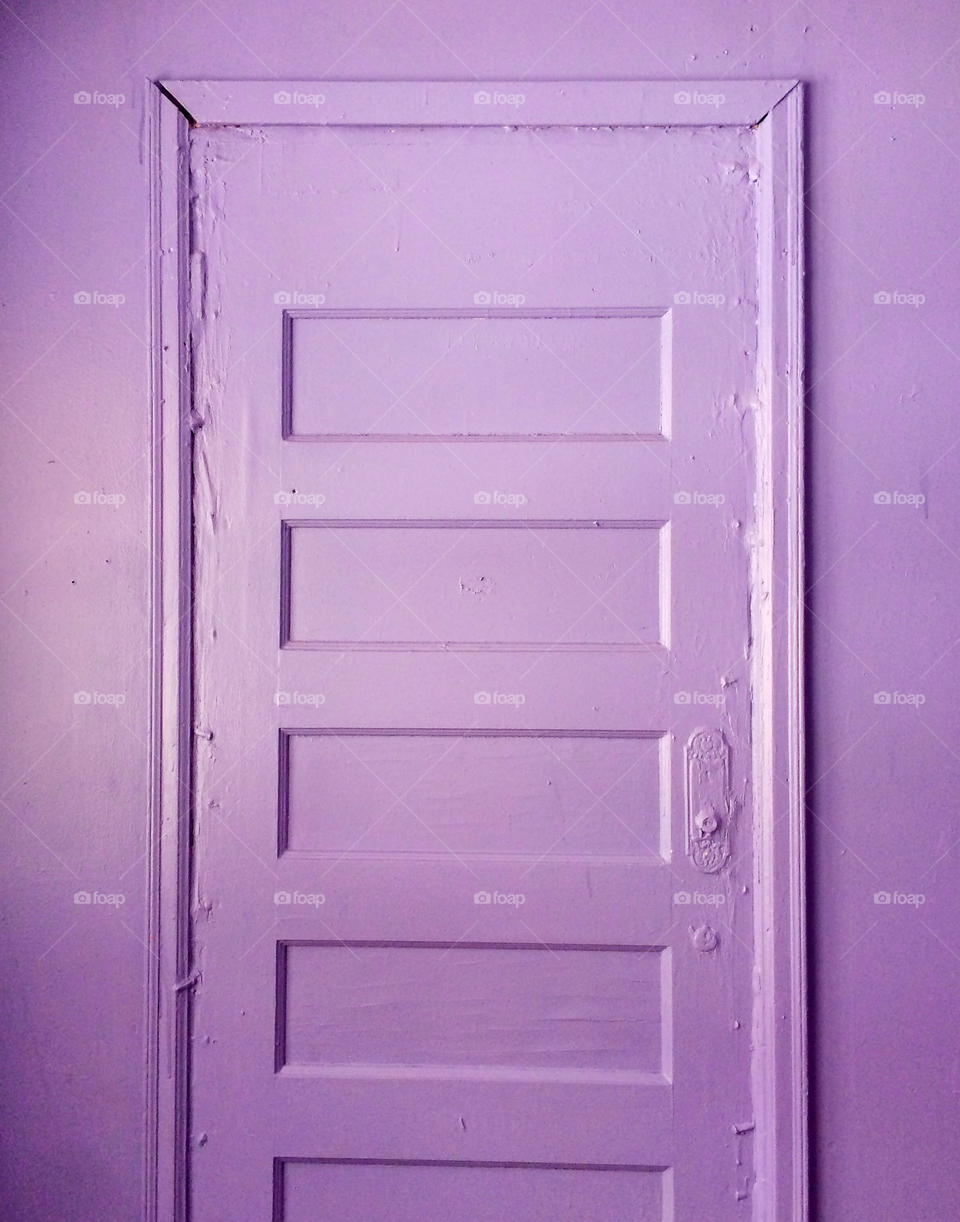Purple lavender painted walls. A wall glued away. 