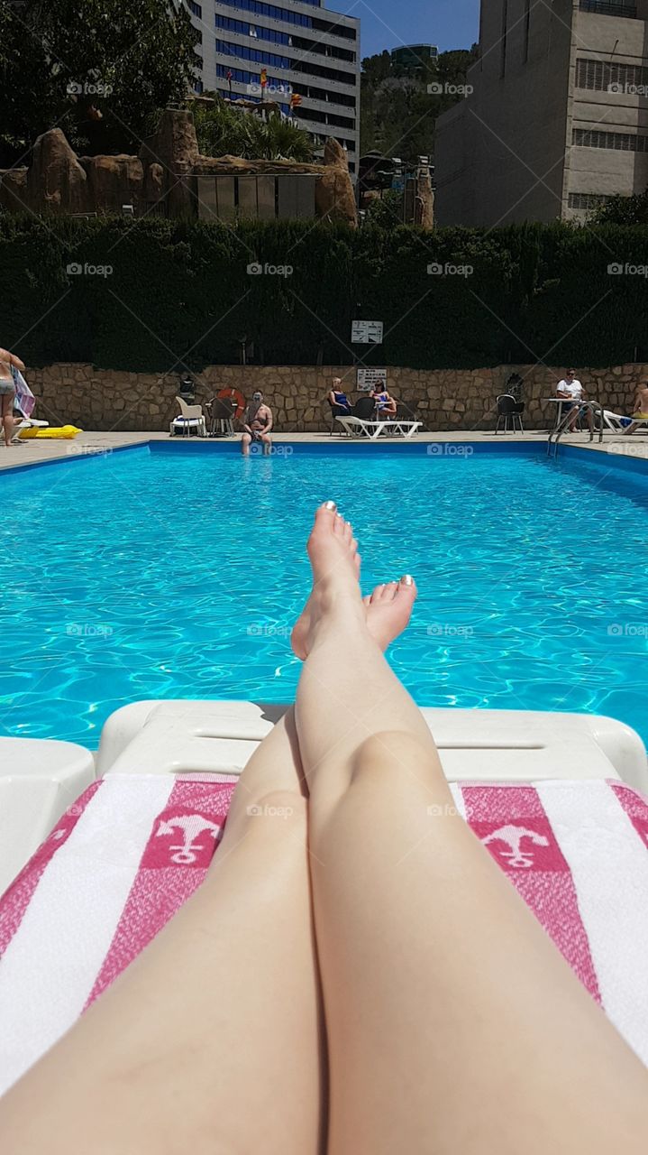relaxing by the pool legs