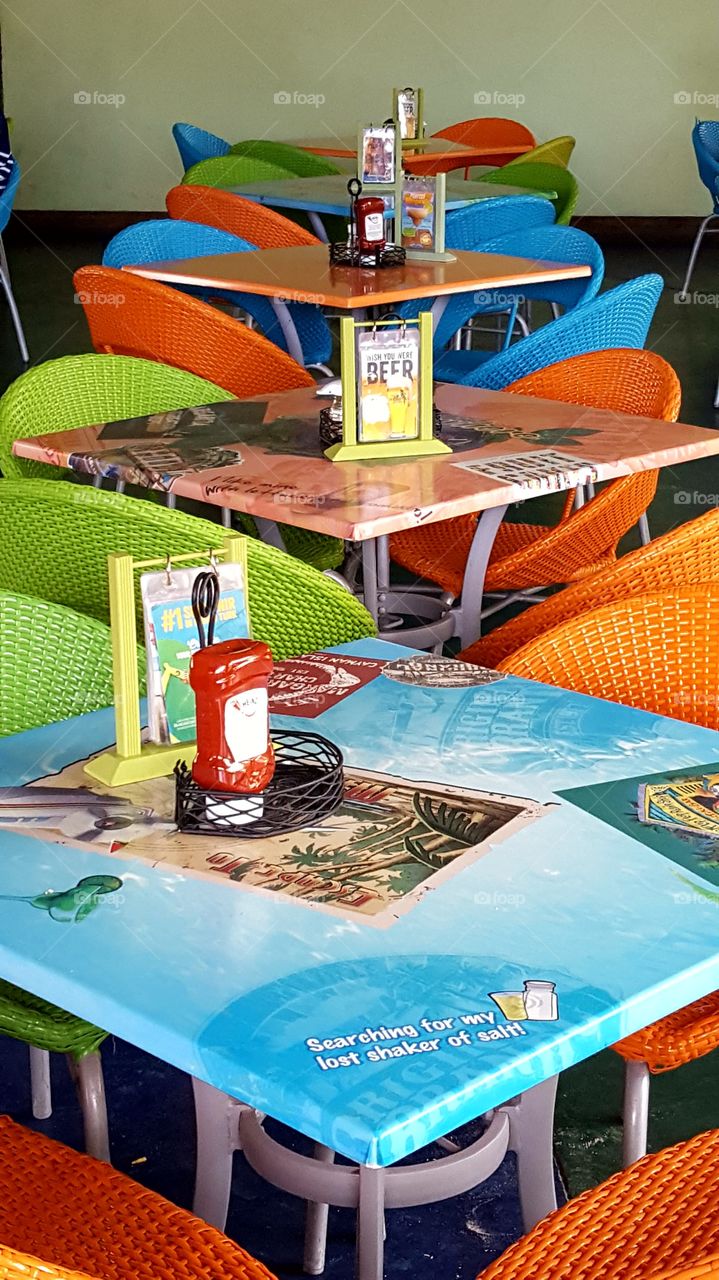 The many different tropical colors of the tables and chairs at Margaritaville, Grand Turk make for a great colorful photo!