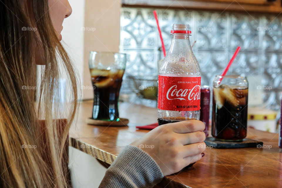 Enjoying a cola- CocaCola.