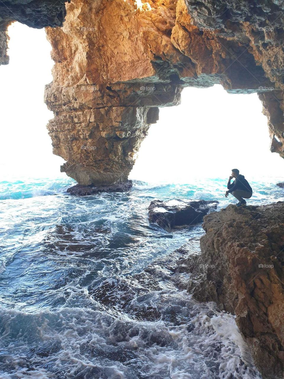 Sea#cave#rocks#human