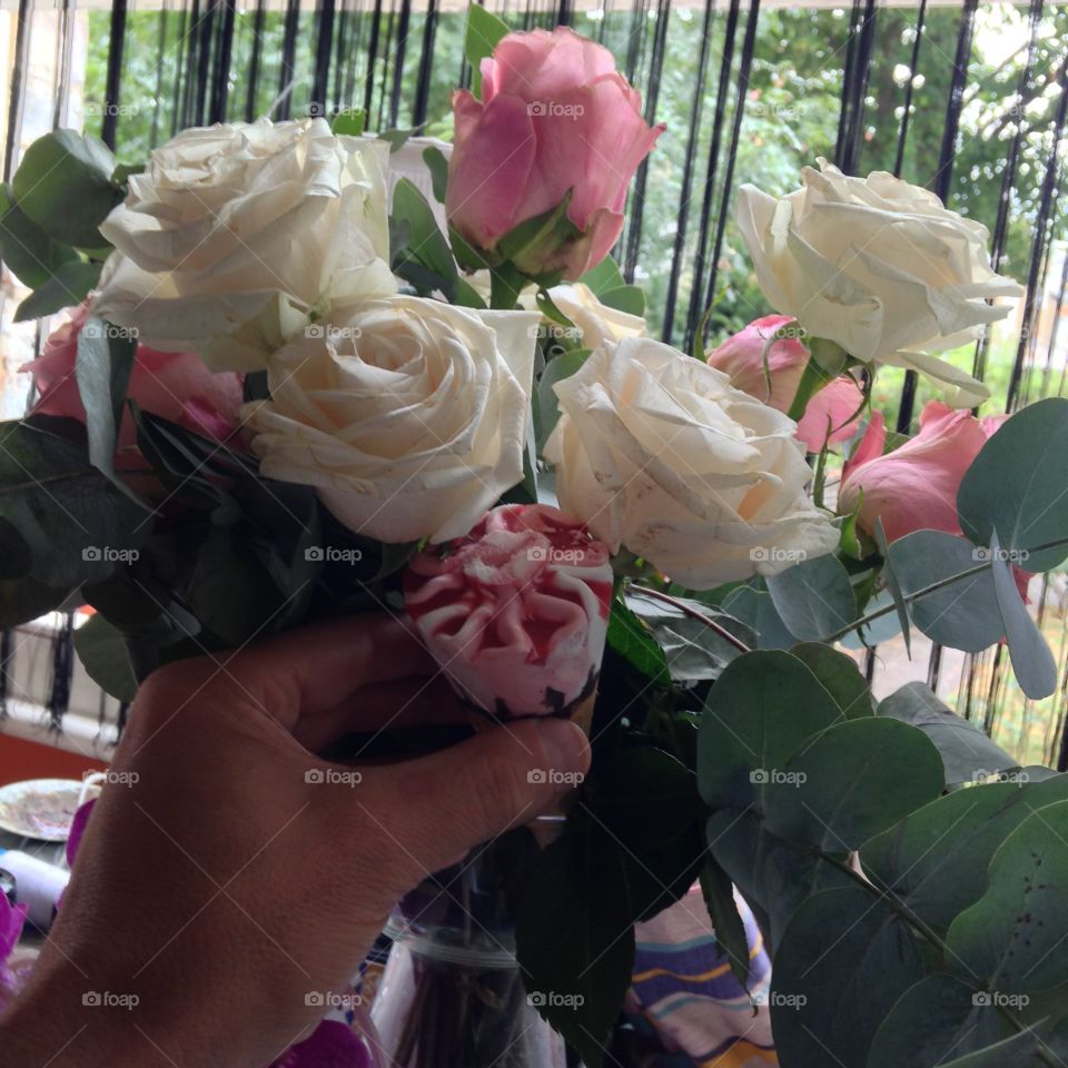 Strawberry ice cream. Ice cream in cone reminded me a pink rose like those roses on my kitchen table