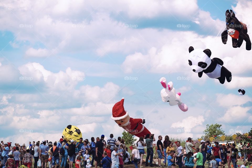Group of people flying kites