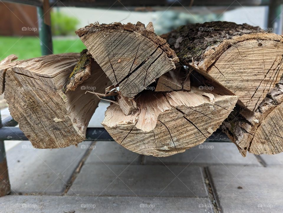 bonfire wood chopped up and neatly stacked on the patio spring bonfires freshly chopped firewood