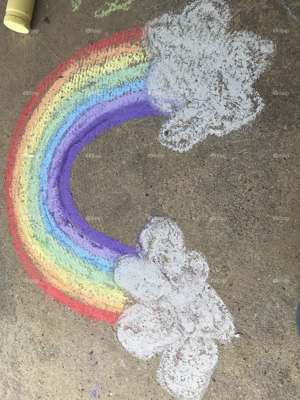 Drawing on the sidewalk with chalk 