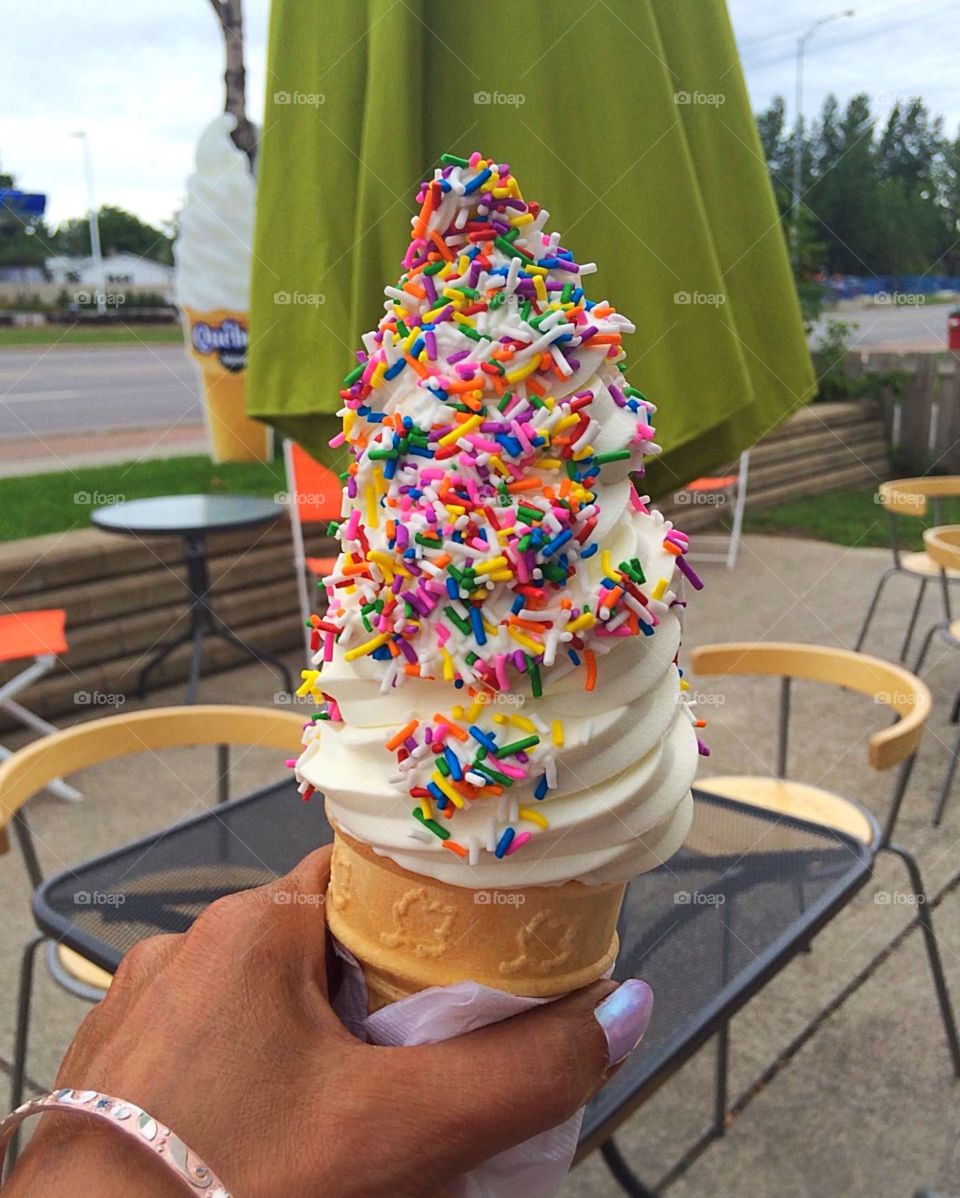 Vanilla ice cream cone dipped in candies