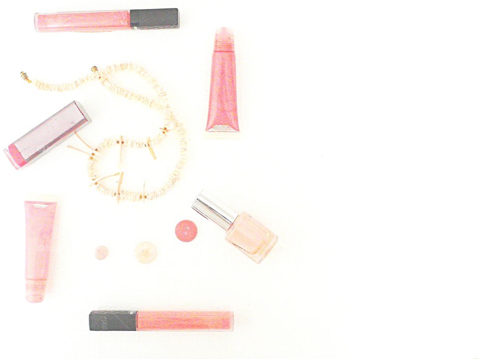 Pink cosmetics on white background 
