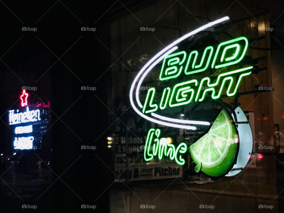 Budlight lime green neon bar sign at Gator’s Dockside in Florida