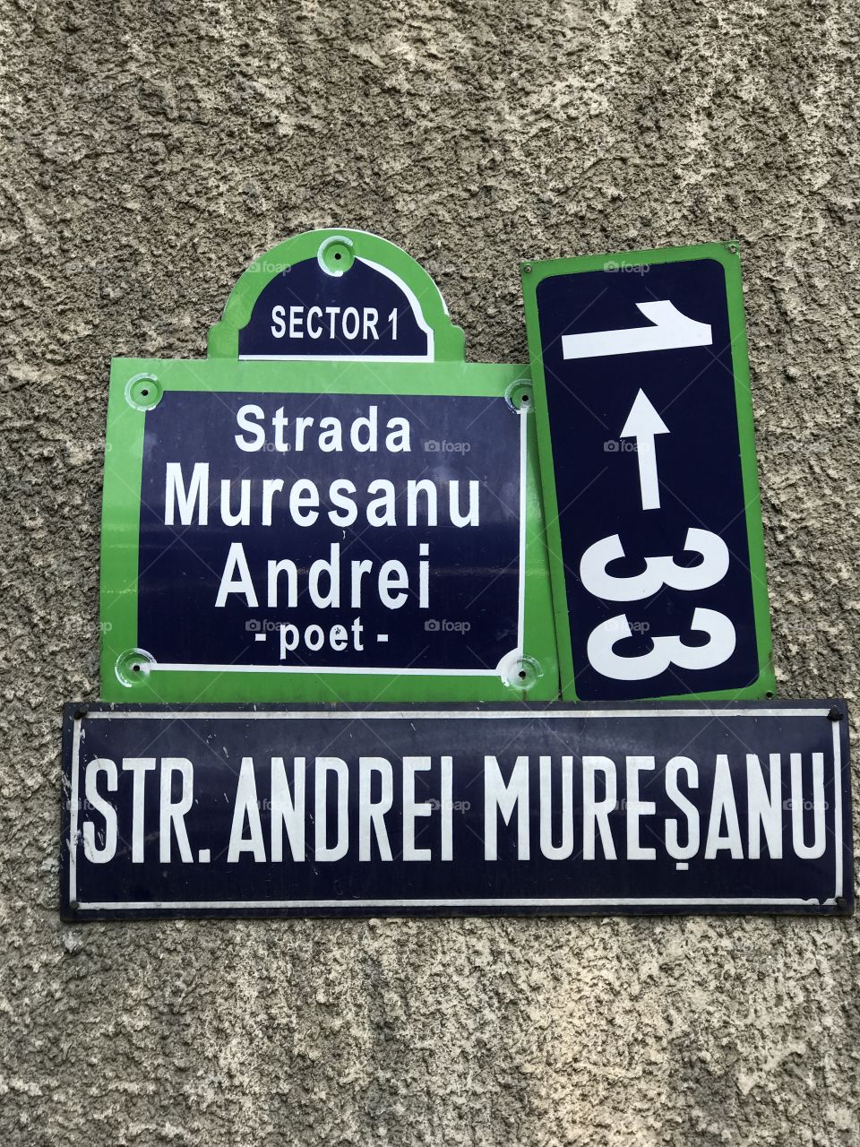 Andrei Muresan street, new and old strret signs in Bucharest, Romania