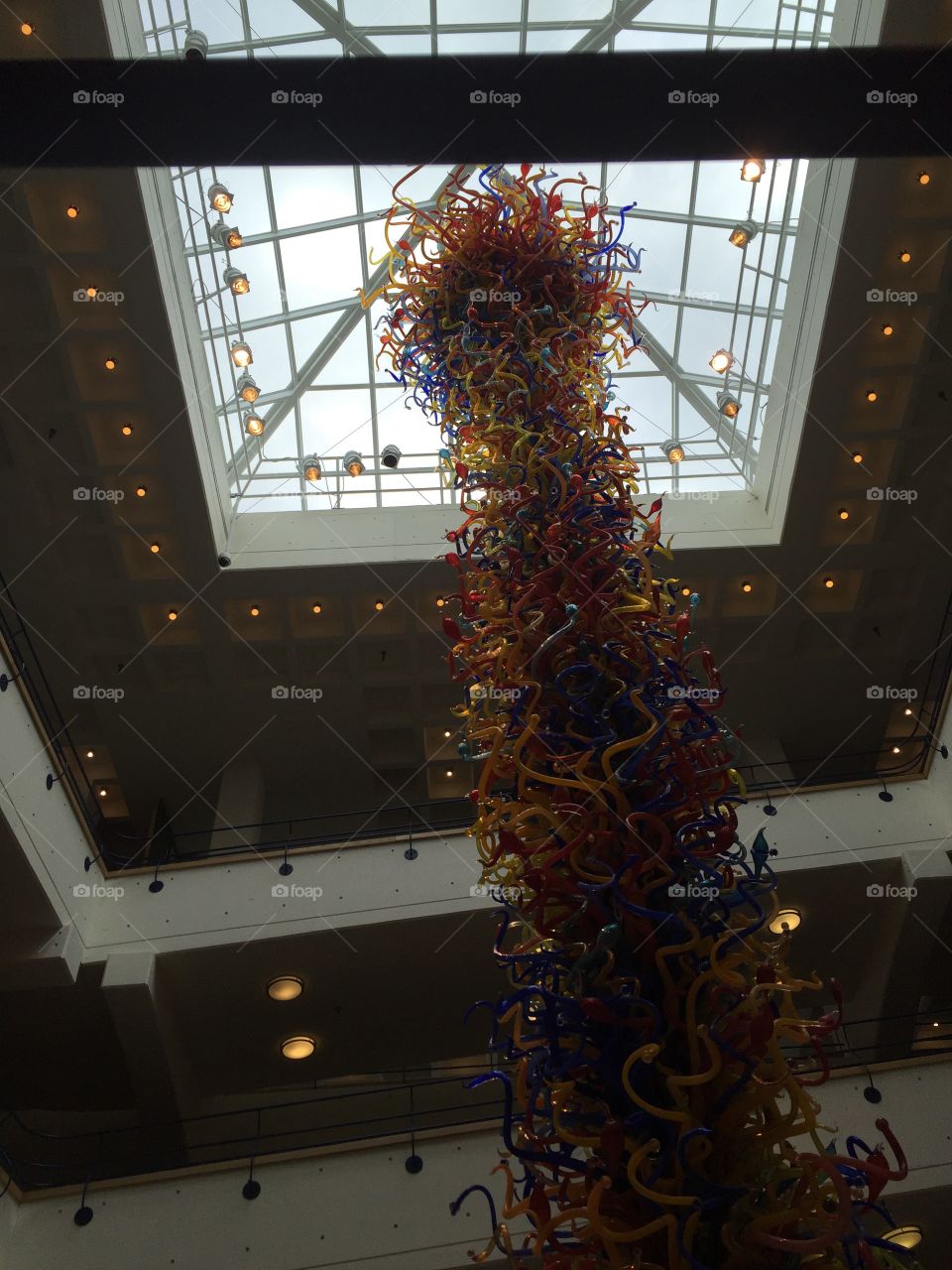 This is a large scale blown glass sculpture at the Indy Children's Museum.  It was made by the artist, Dale Chihuly.  
