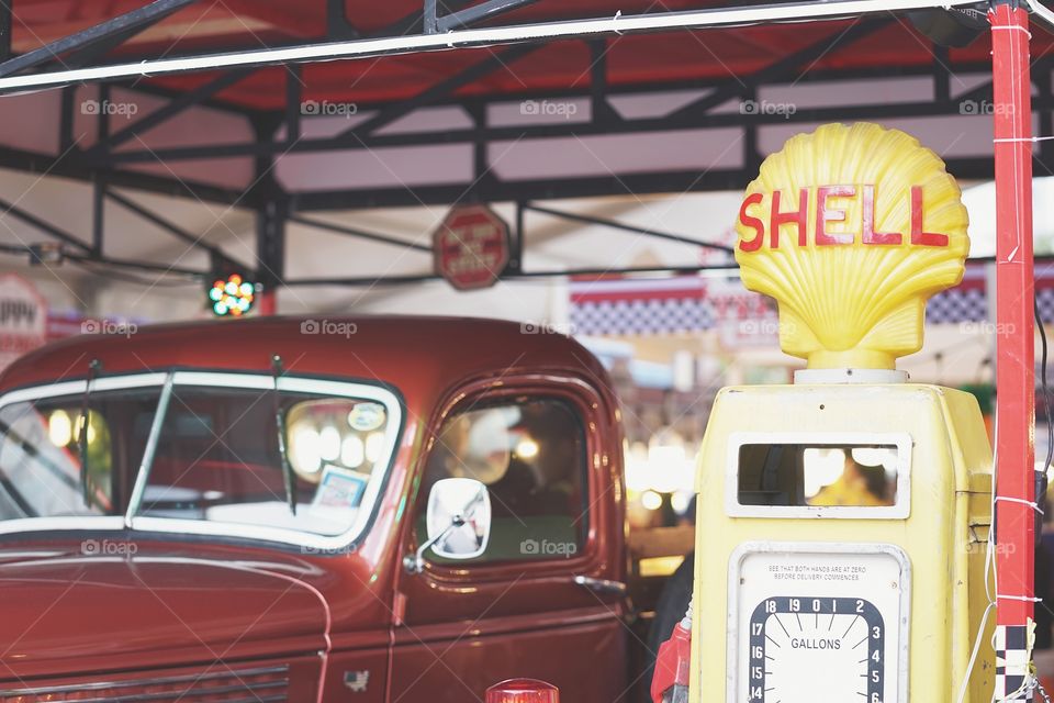 Bangkok, Thailand - May 5, 2018 : A photo of red retro pick-up truck nearby the SHELL gas station. This is a scene set up for display and take photo. Selective focus on the logo of SHELL.