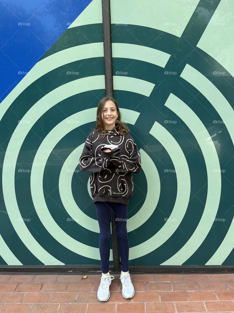 The crazy swirly smiley face of a young girl living her best life and finding joy in everything that she does.