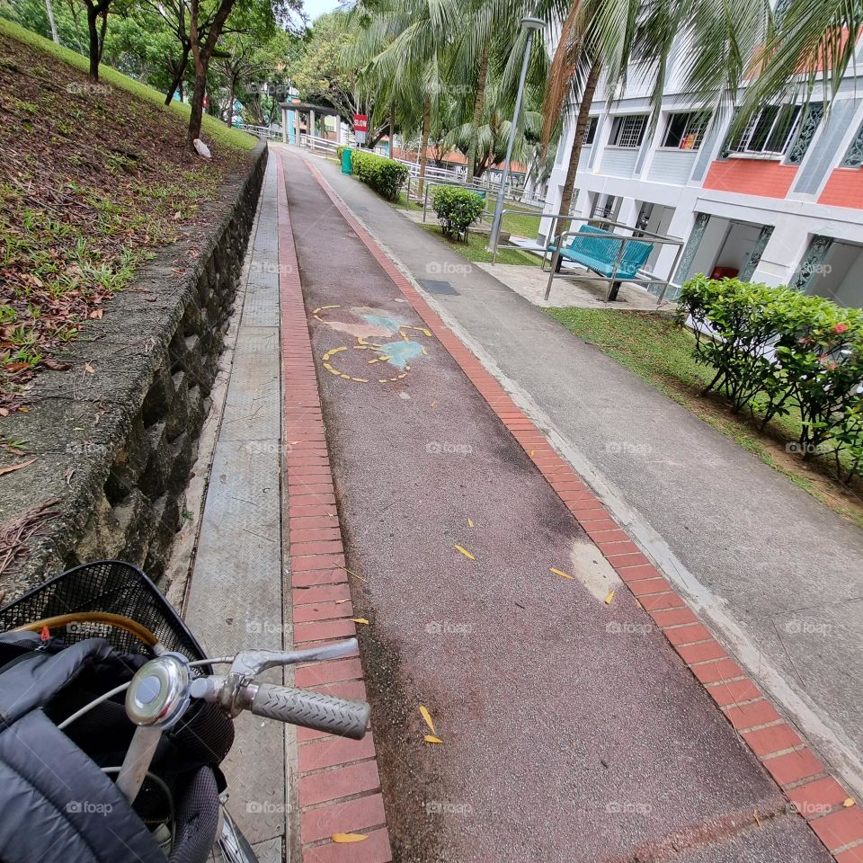Multicoloured patchwork on bumpy potholes in a bike track