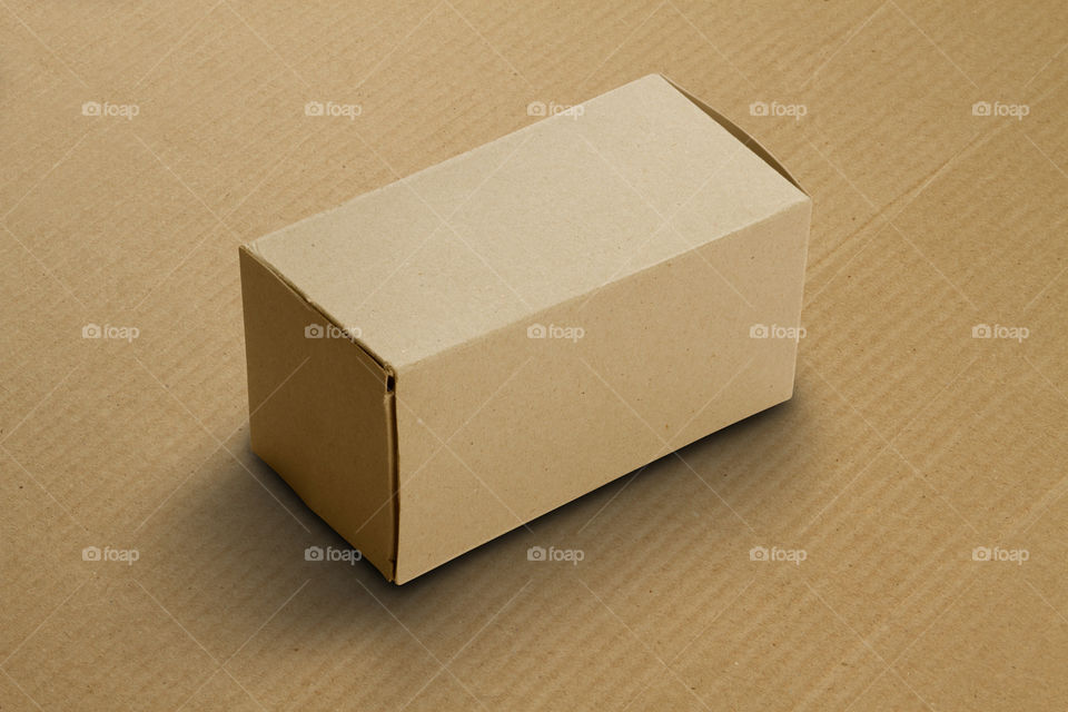 Brown recycled Cardboard box on brown corrugated cardboard