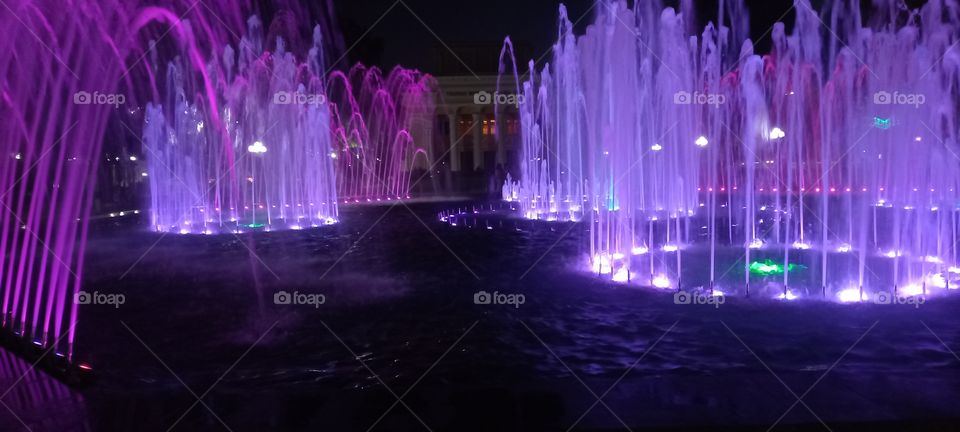 on a hot summer evening, it's fun to walk by the fountains