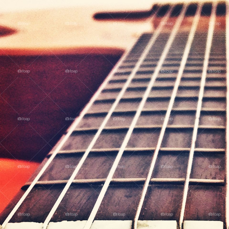 Close up to the strings of an acoustic guitar