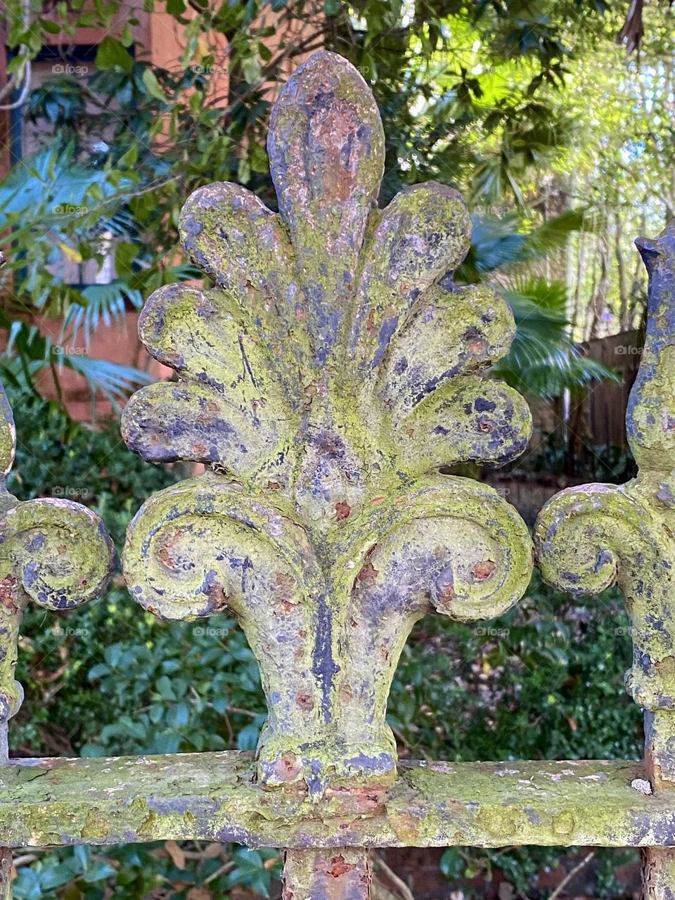 Rusted metal decoration on a fence