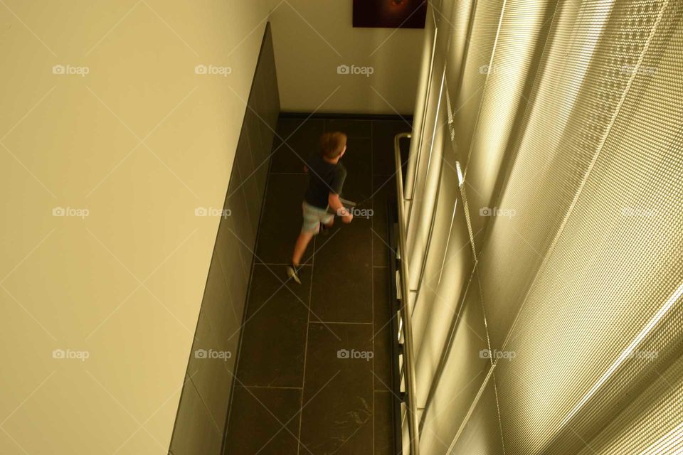 child running through a hall