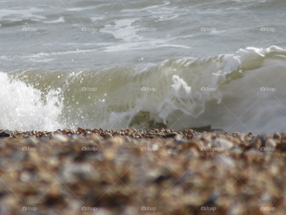 Hastings beach with the tide rolling in