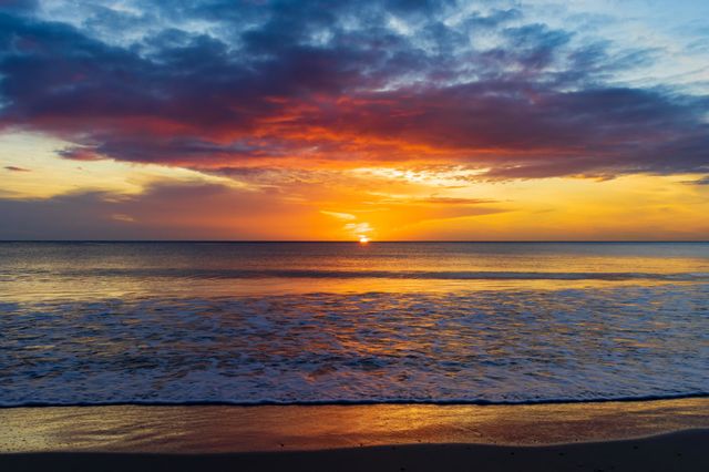 Sun rise with clouds creating magical colours. Perfect summer morning in Trincomalee, Sri Lanka.