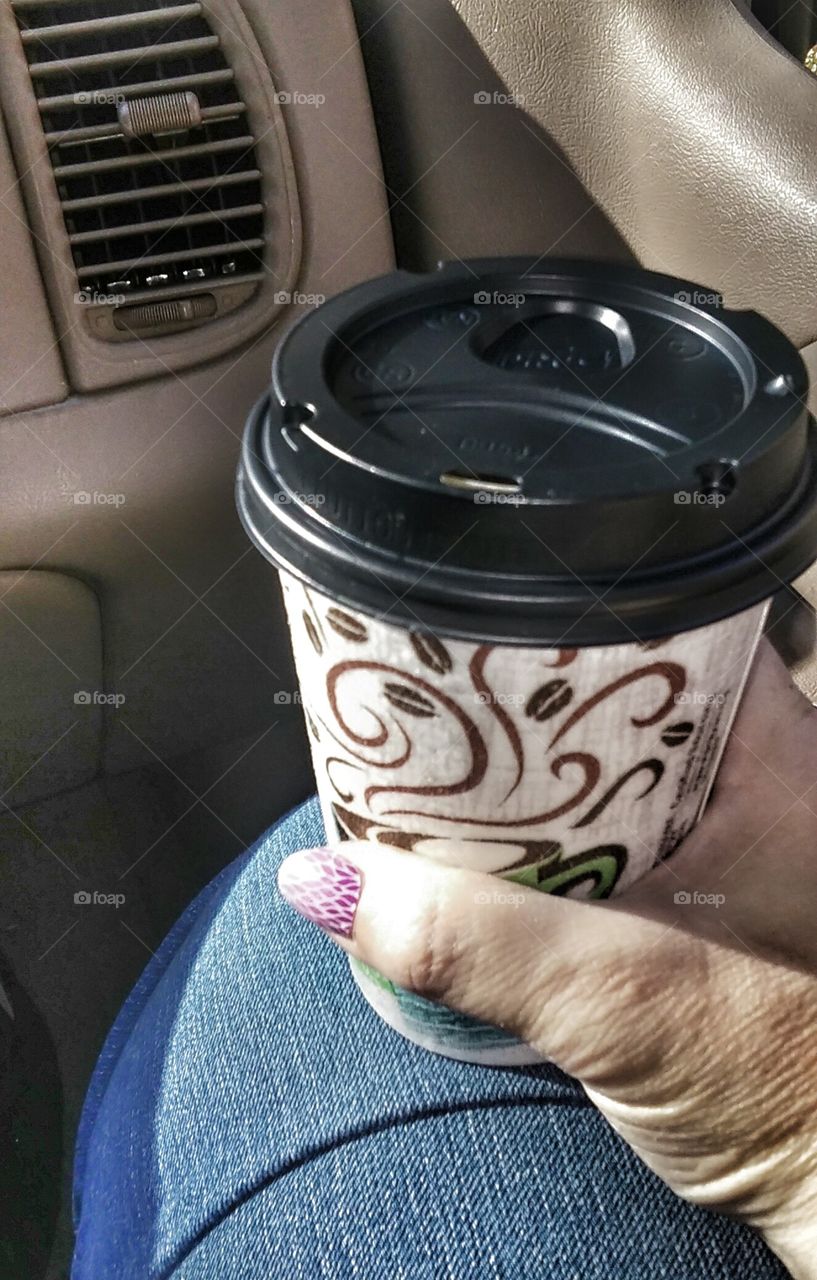 Coffee on the go. Taking my coffee with me in the car...yum.