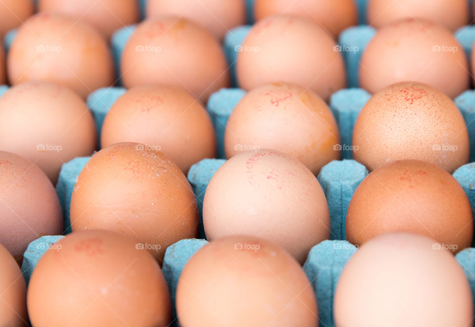 Brown Eggs In Cardboard Box
