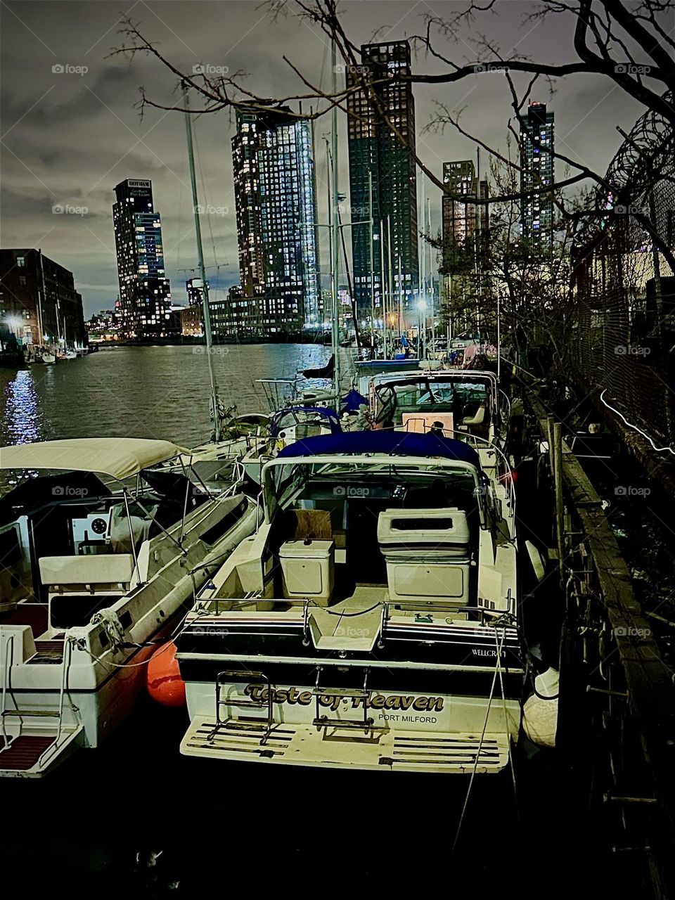 The boats of “Newtown Creek” by the “Pulaski Bridge” in LIC, Queens look even more charming at night when the lights of the city are reflected in the water of the “East River” and lend it a beautiful silvery sheen. 2023. Hypnotic Productions