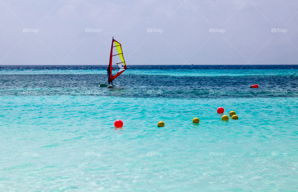 Windsurfing board sailing in sea