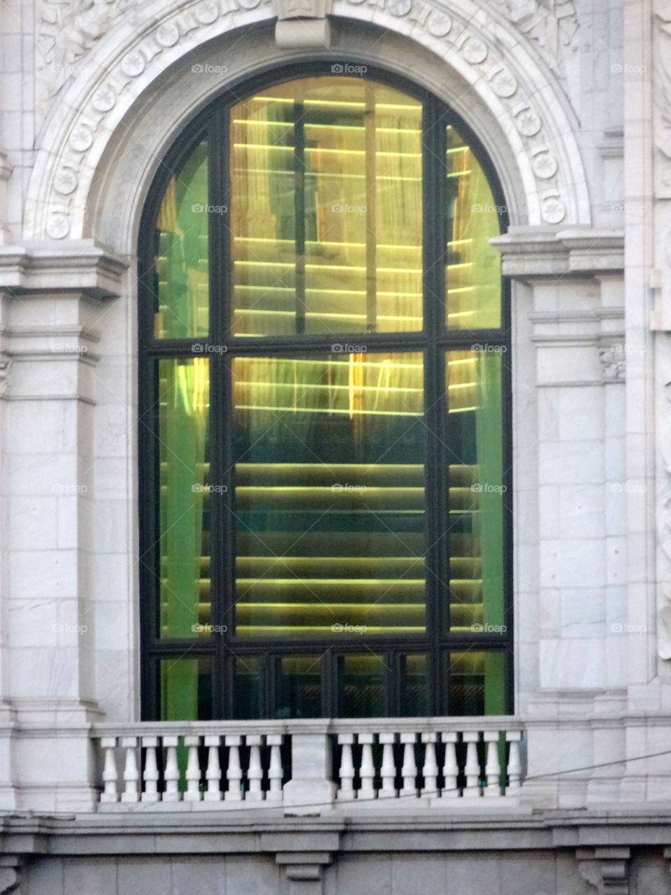 reflection on an old building in Madrid