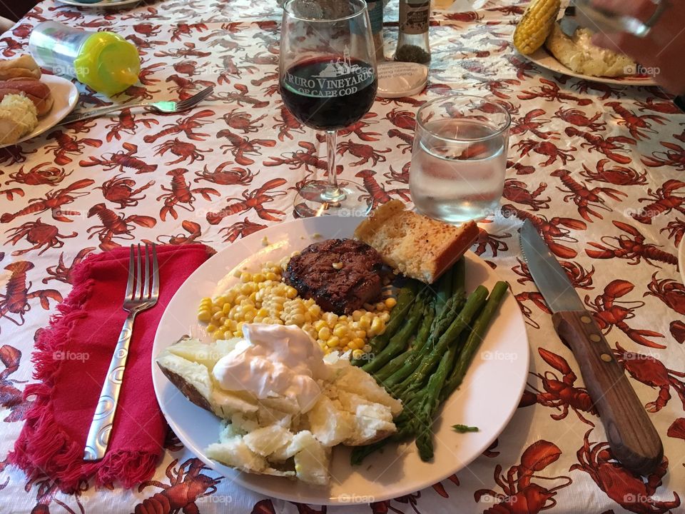 Sunday night dinner with the family. A perfectly grilled filet mignon, some complimentary sides and a glass of dry red wine. Nirvana!