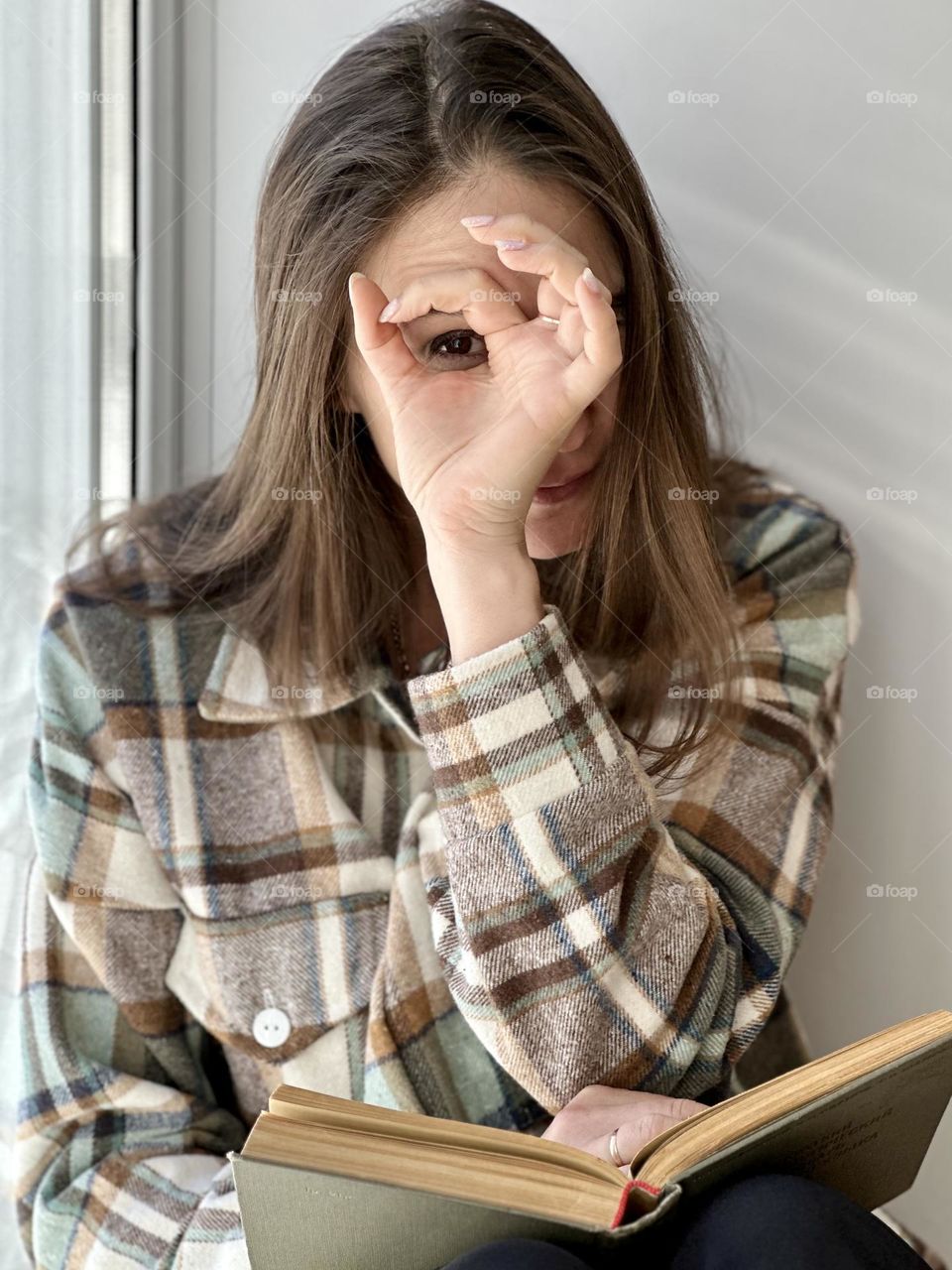 portrait of a woman at the window