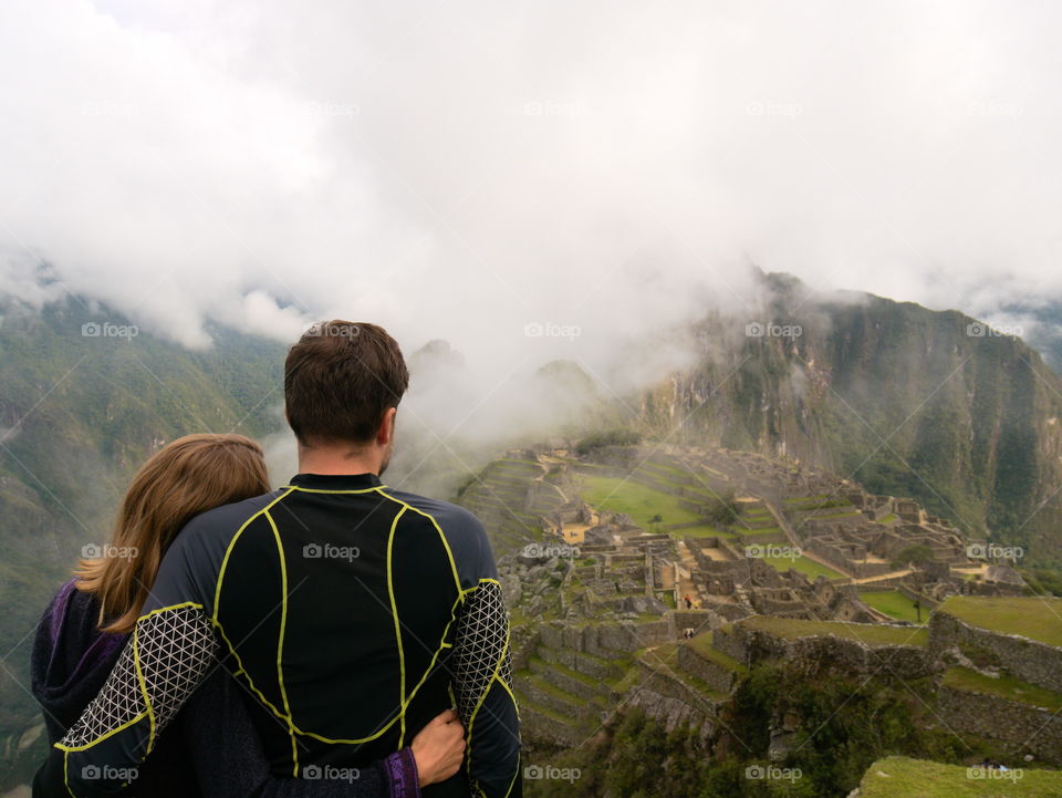 Couple enjoying view over Machu Picchu