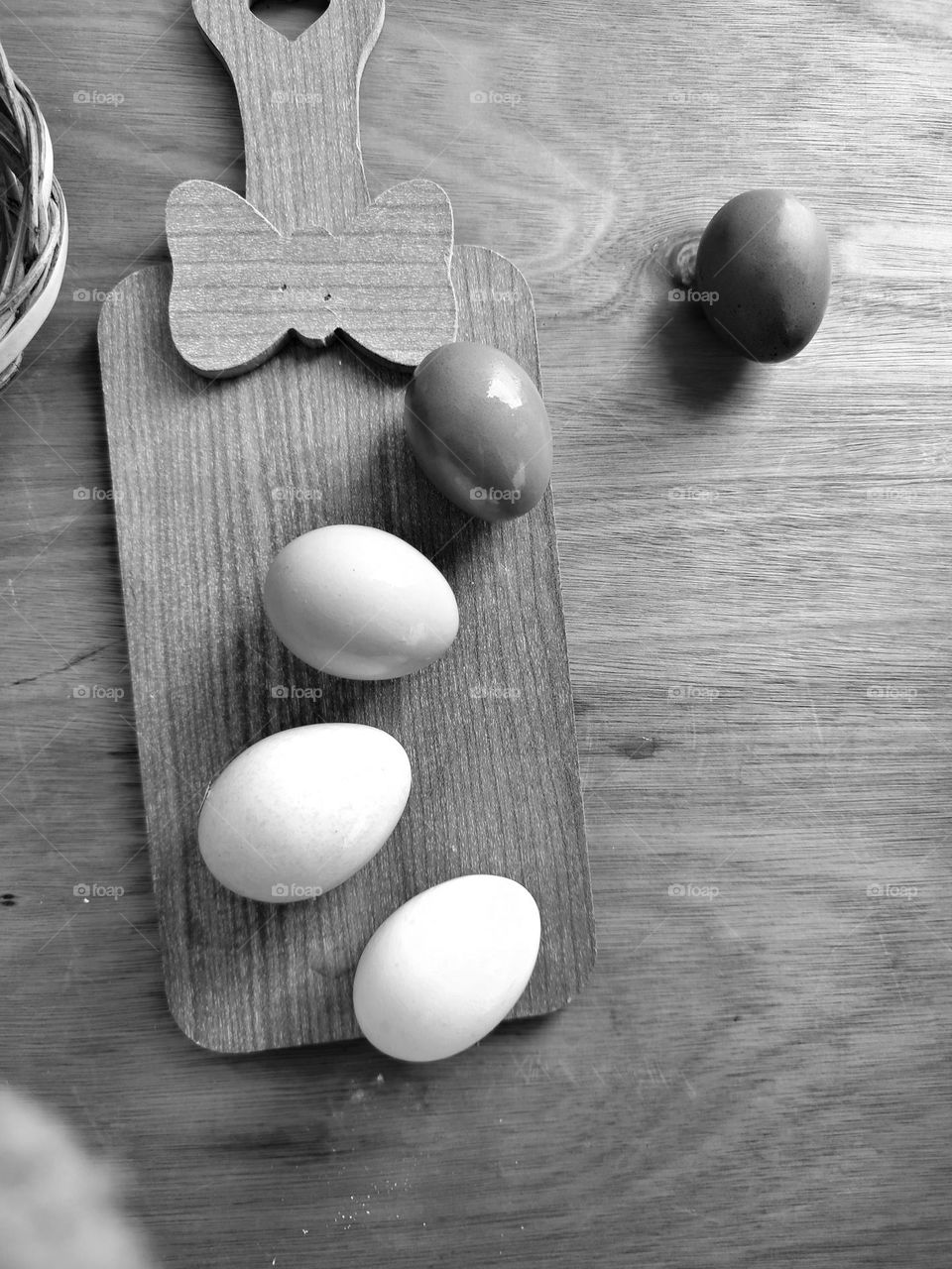 Eggs on wooden table Black and white