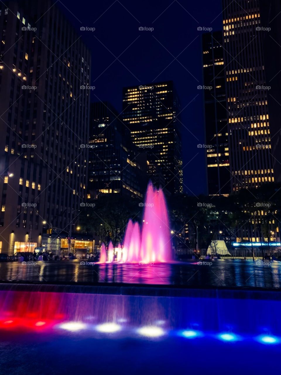 Colorful fountain in front of the f the building New York City. 