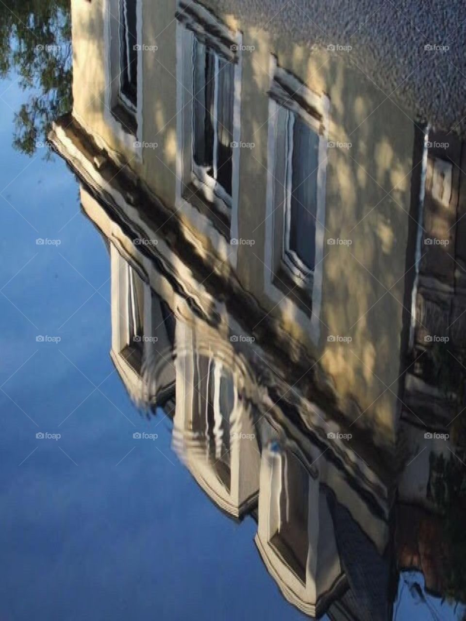 Water droplet - for a second the whole city seemed like the ocean - with it's clear reflection. Love my home town.