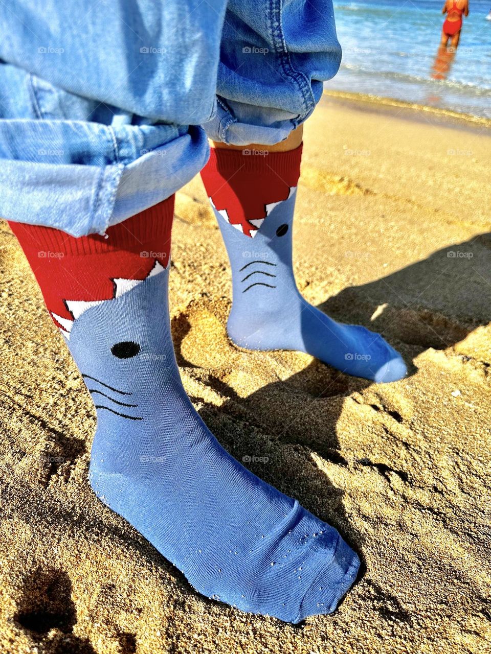 Standing in the sand with my shark attack socks on, ready to peel off clothes and jump in the ocean