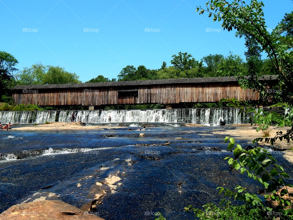Covered bridge and waterfall at Watson mill state park, Georgia