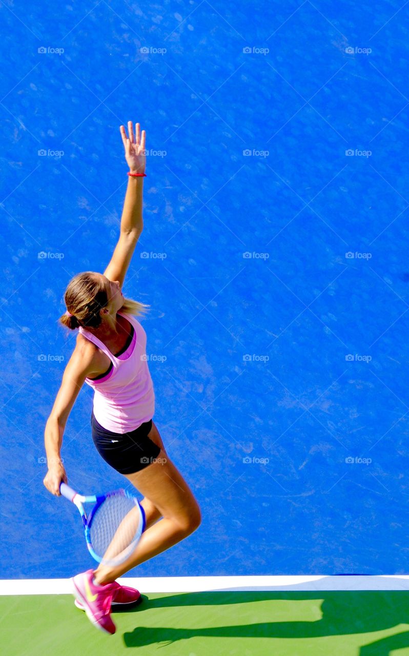 High angle view of woman playing badminton