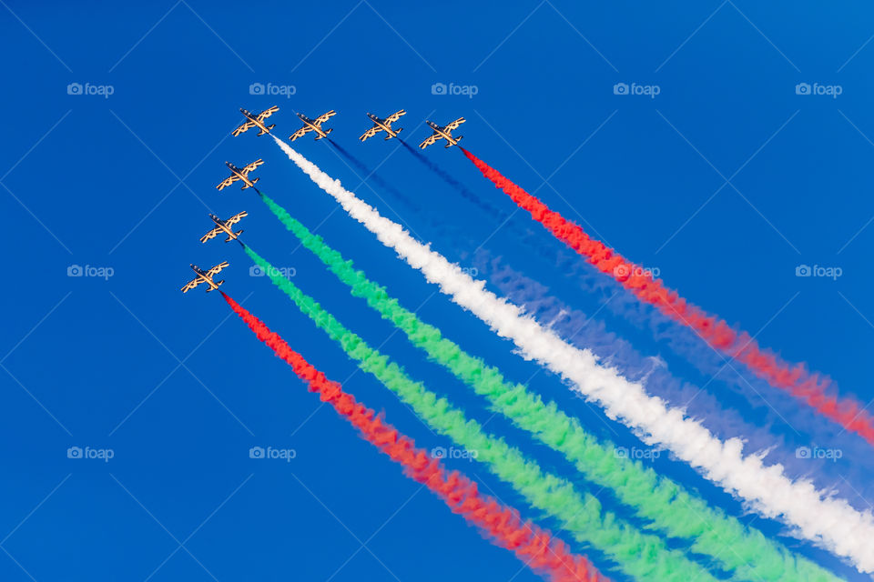 Aerobatic team flying in the formation in the blue sky