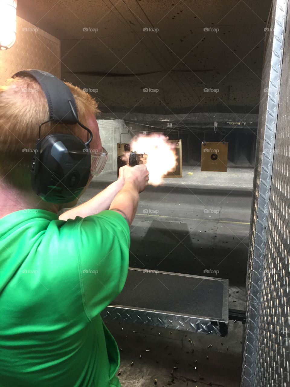Gun Shoot Range Flame. Shooting a Sig Sauer 9mm Pistol 