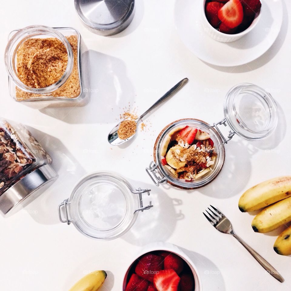 Preparing fresh fruit muesli for breakfast