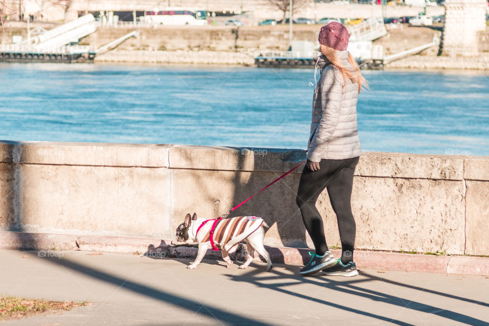 Fitness Young Girl With Her Dog Walking Outside