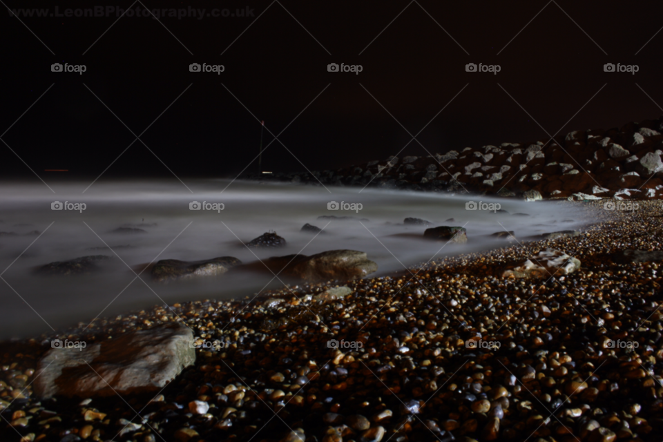 beach night sea rocks by leonbritton123