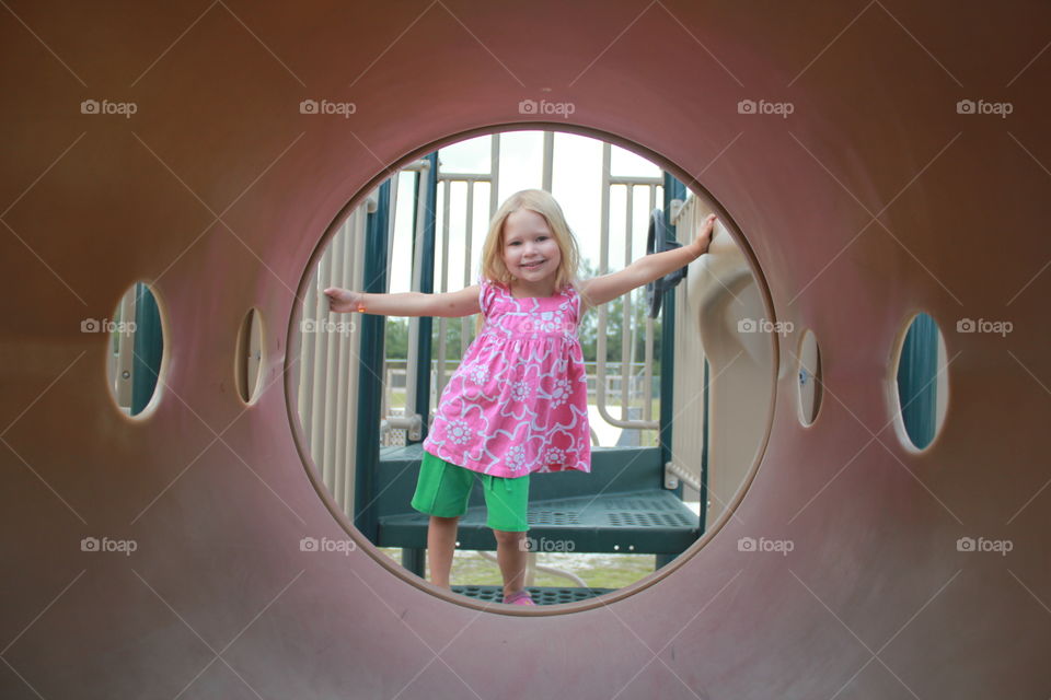 Little girl playing on playground 