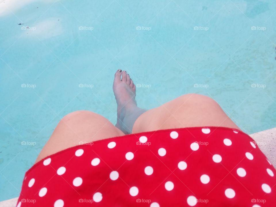 feet on the pool side