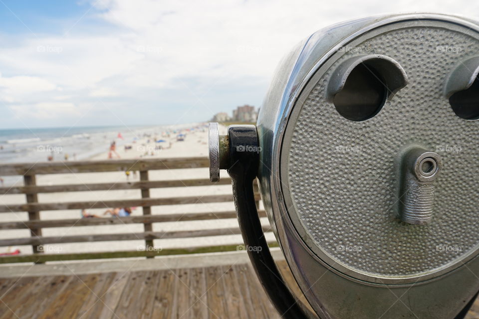 Close-up of Telescope at beach