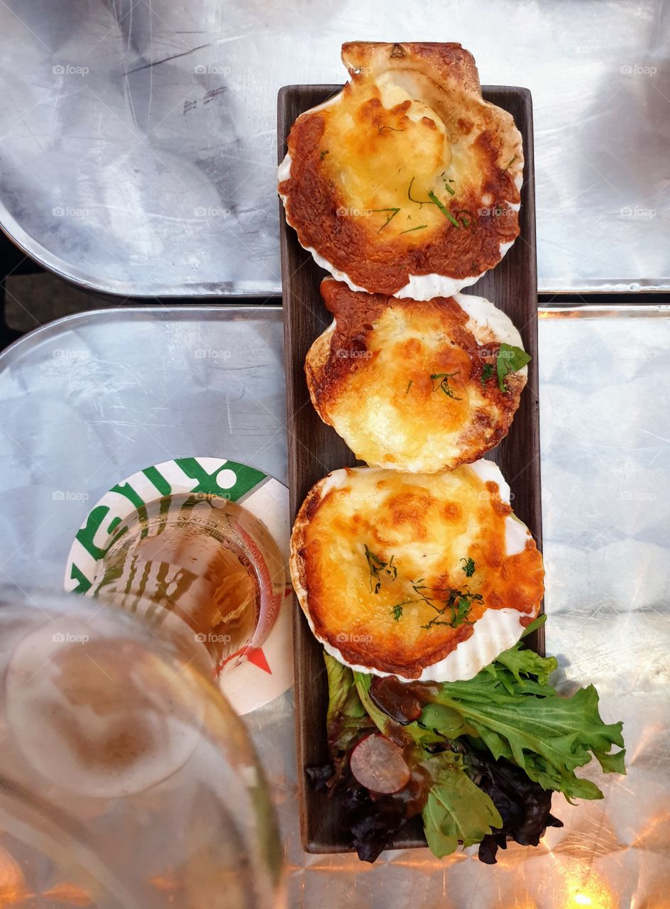 Delicious scallops on sea shells