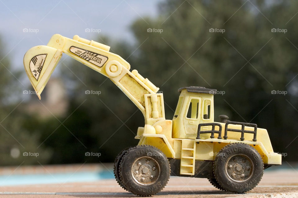 yellow construction child toy by ventanamedia