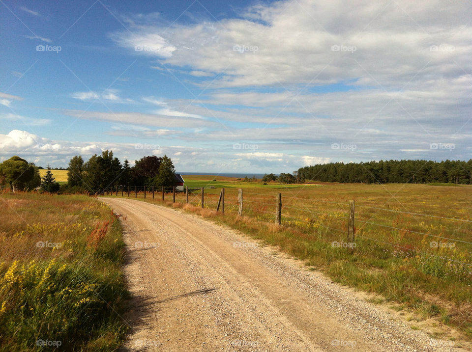 landscape sweden clouds road by jethro